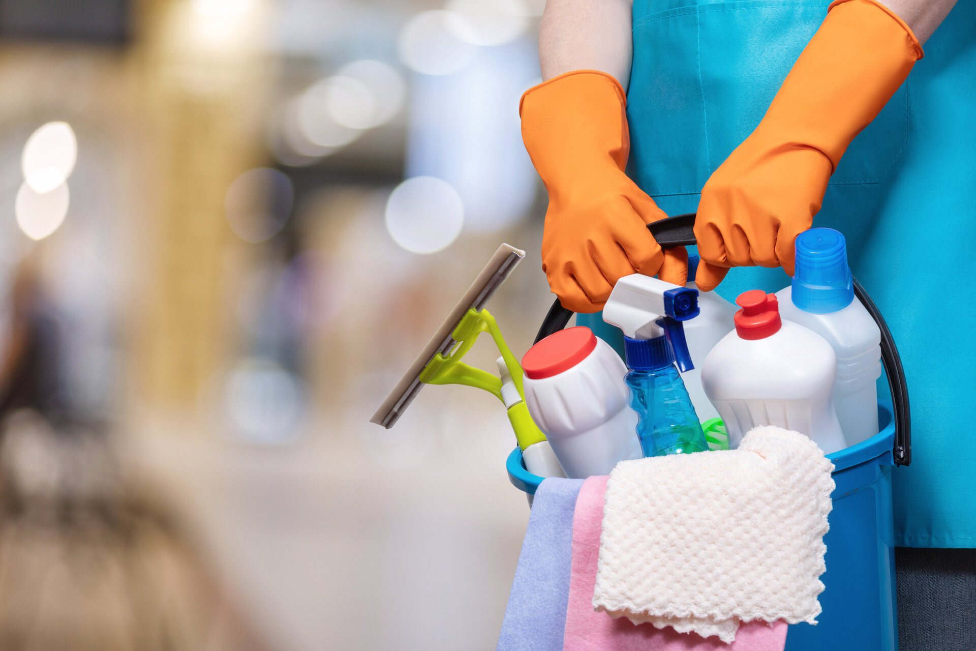 Worker holding cleaning materials