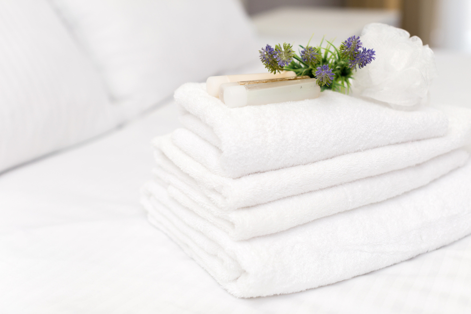 Clean towels on bed